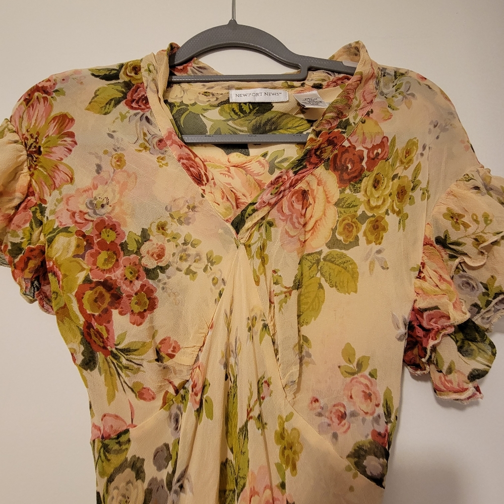 Form fitting sheer dress long falls around ancles